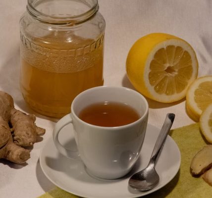 A cozy setup featuring ginger lemon tea with honey, promoting wellness and comfort.